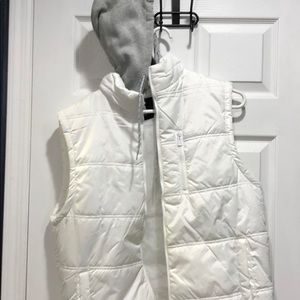 White puffy vest with hood.